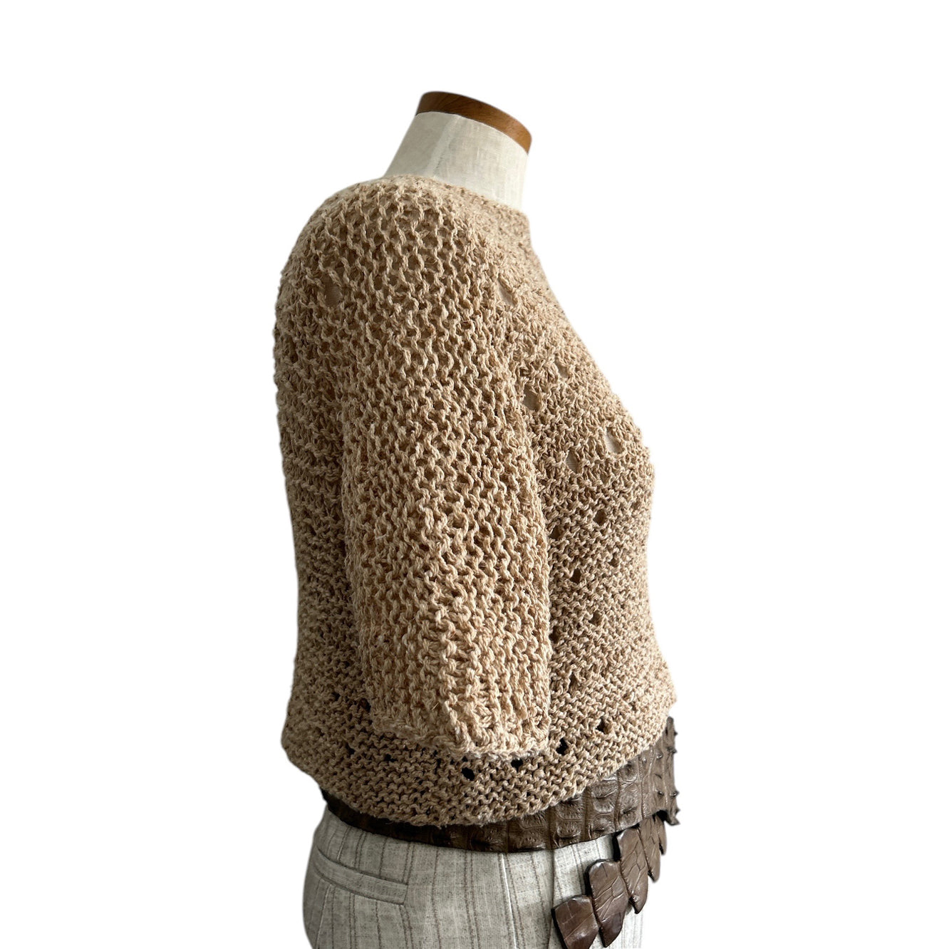Side view of Chiara Toffanin's lightweight almond crochet crop top featuring a relaxed fit