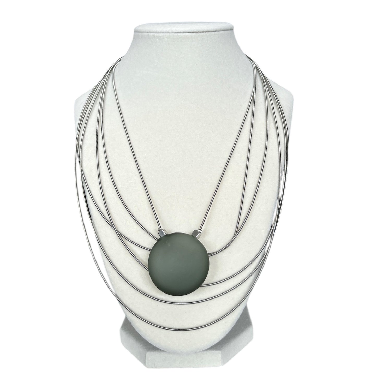 Elegant Murano glass necklace with frosted green pendant and layered silver strands, sold at Aqualta