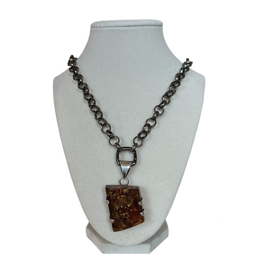 Amber pendant on a long blackened rolo chain Peggy Goodman Sold At Aqualta