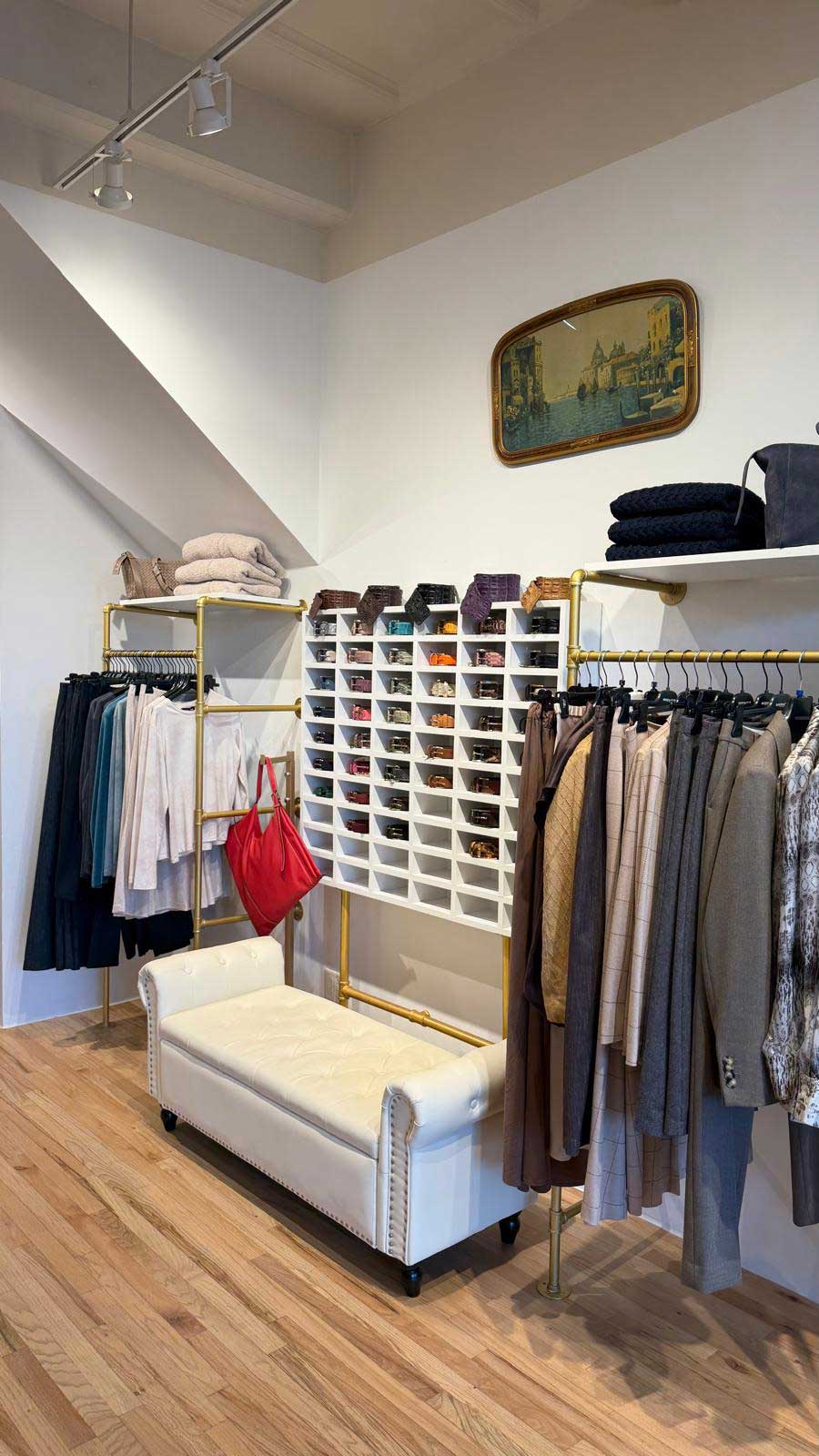 View of Aqualta fashion boutique interior with designer apparel and accessories.