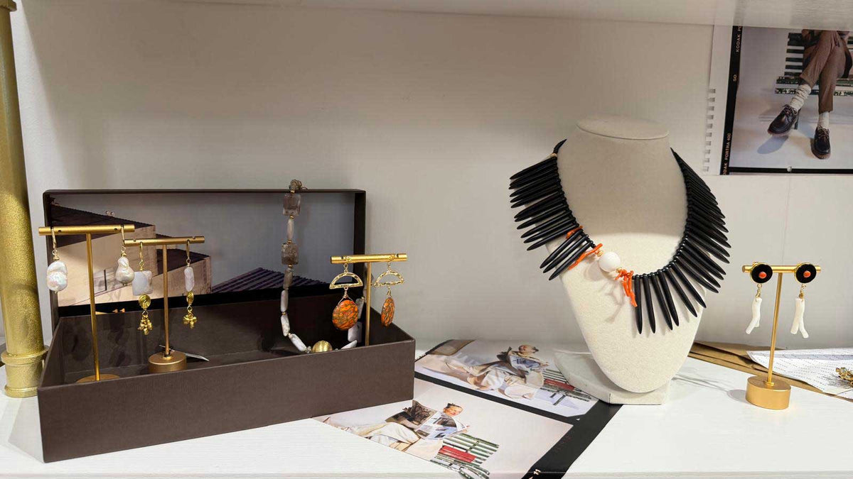 Designer jewelry showcase at Aqualta with necklaces, pearl earrings and colorful statement pieces.