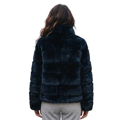A woman viewed from the back wearing a Black Rex Short Jacket Suprema sold at Aqualta