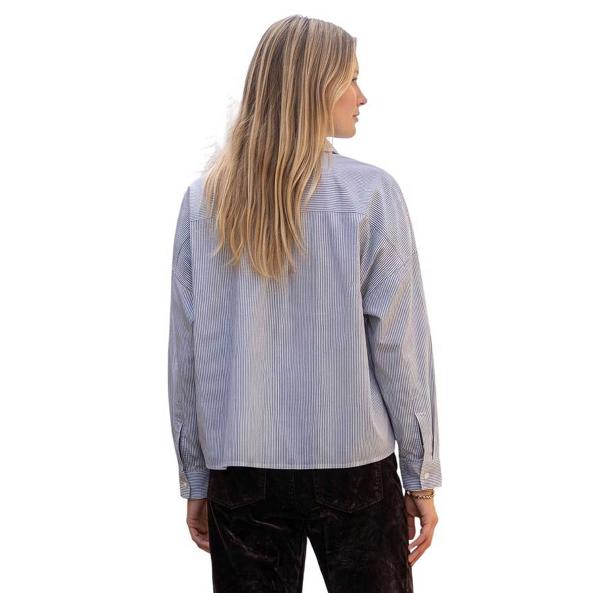 Back view of La Sartoria Pettegole pinstripe shirt showing the relaxed fit, dropped shoulders, and classic striped pattern.