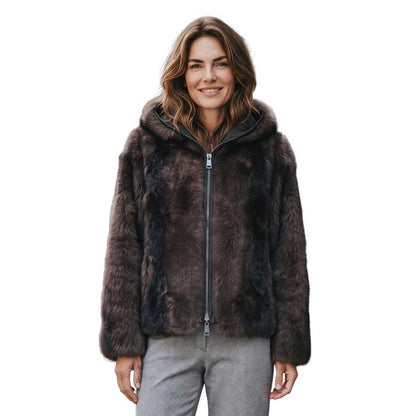 A woman wearing a Brown Reversible shearling Jacket Suprema sold at Aqualta