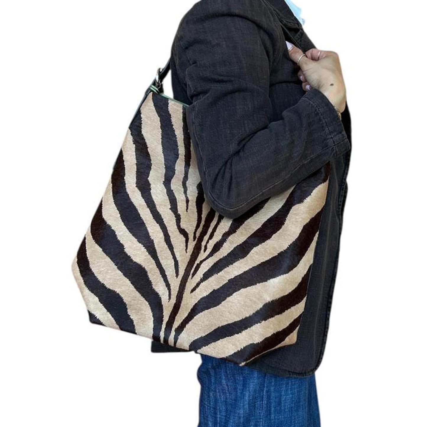 Women wearing Bucket Bag Pony hair Zebra print sold at Aqualta