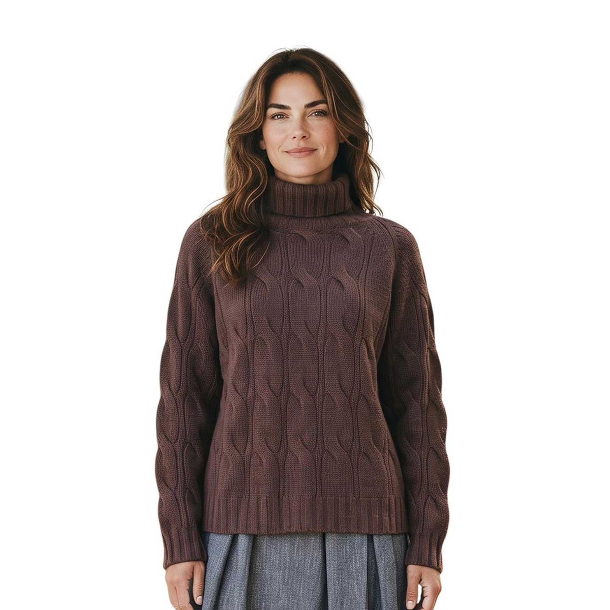 Woman wearing a cable knit cashmere turtleneck sweater in brown by Sand, sold at Aqualta, styled with a pleated gray skirt.
