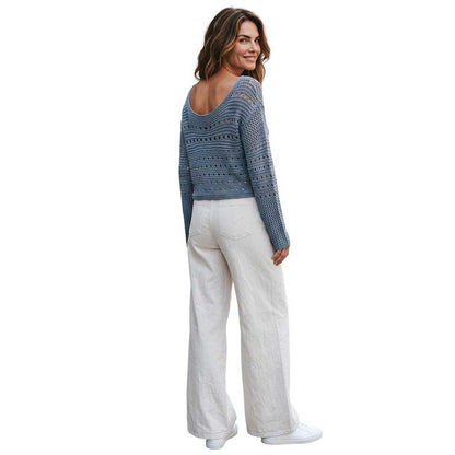 Woman wearing a Coated Off White Denim Flare cut Shaft Jean sold at Aqualta 4