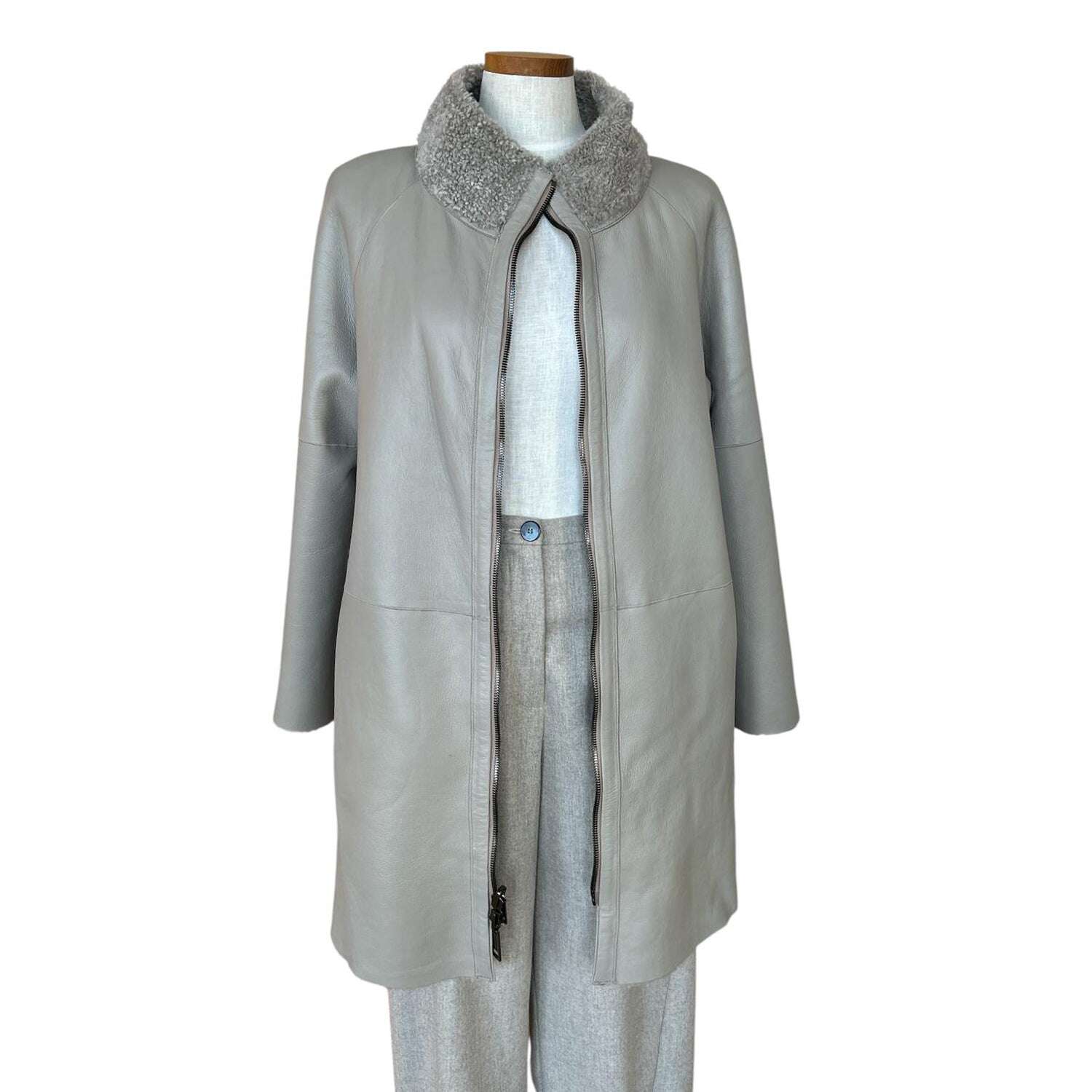 Front picture of our Reversible Merinos Coat Curly Fur Sand color Suprema sold at Aqualta