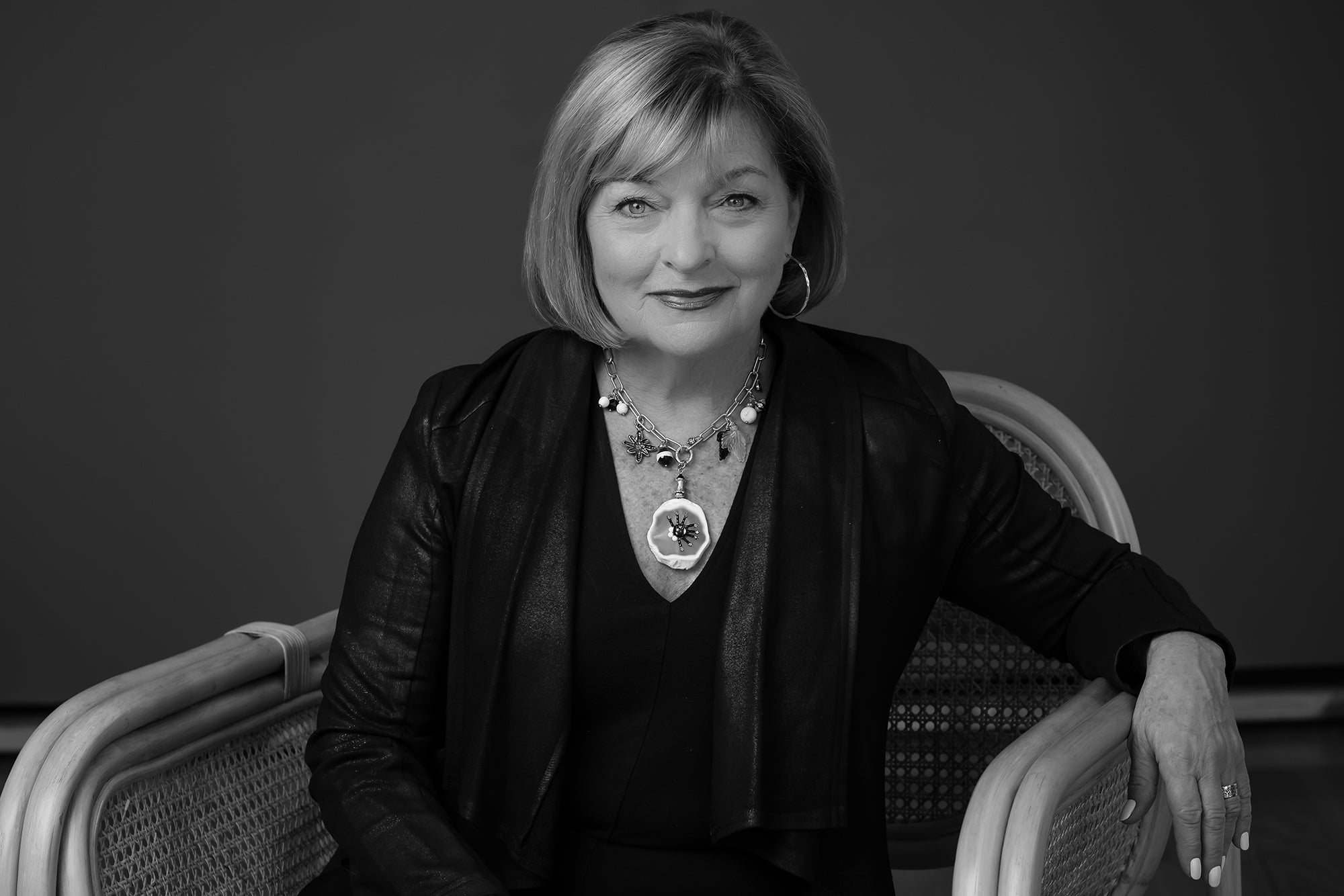 Peggy Goodman, jewelry designer at Aqualta Wear, showcasing her statement necklace and luxury accessories 2