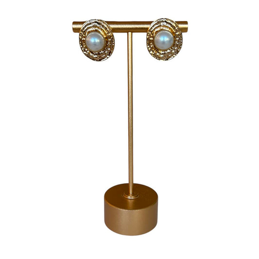 Handmade pearl stud earrings by Peggy Goodman for Aqualta, featuring luminous pearls set in textured gold frames