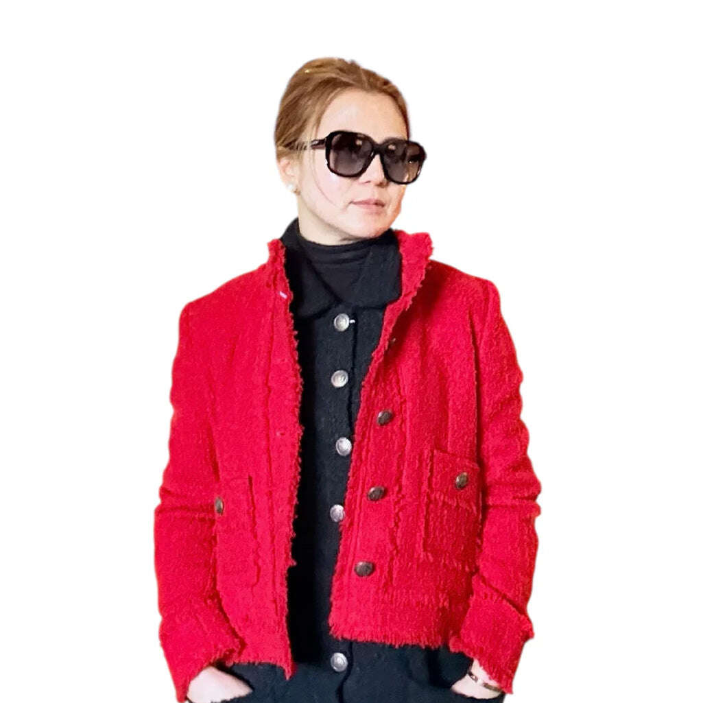 This red tweed short jacket brings a bold yet timeless touch to any wardrobe