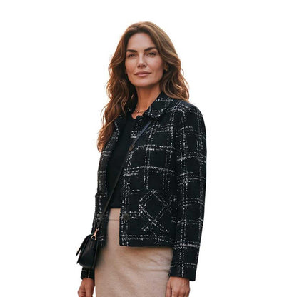 Short black and white tweed collar jacket by Sand, sold at Aqualta, featuring a button-front design and patch pockets.