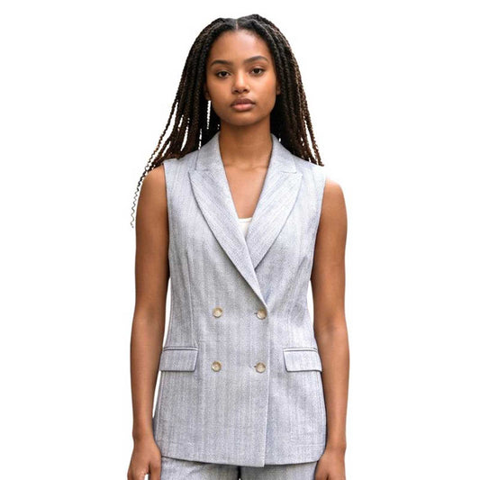 Woman wearing a Sleeveless Jersey Jacket White Herringbone Goodmatch sold at Aqualta