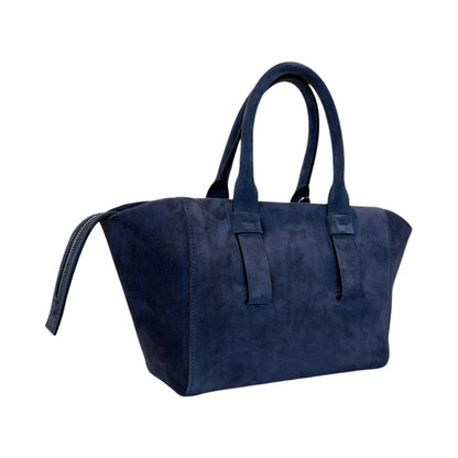 A woman wearing a Small Suede satchel Blue Biagini sold at Aqualta 2