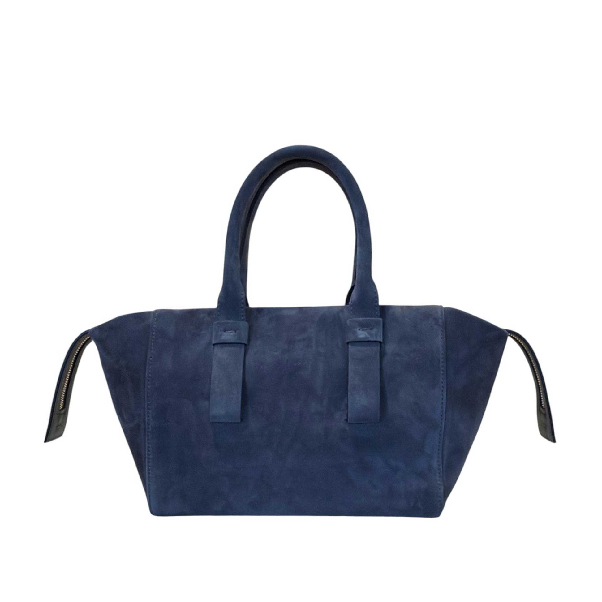 A woman wearing a Small Suede satchel Blue Biagini sold at Aqualta 3