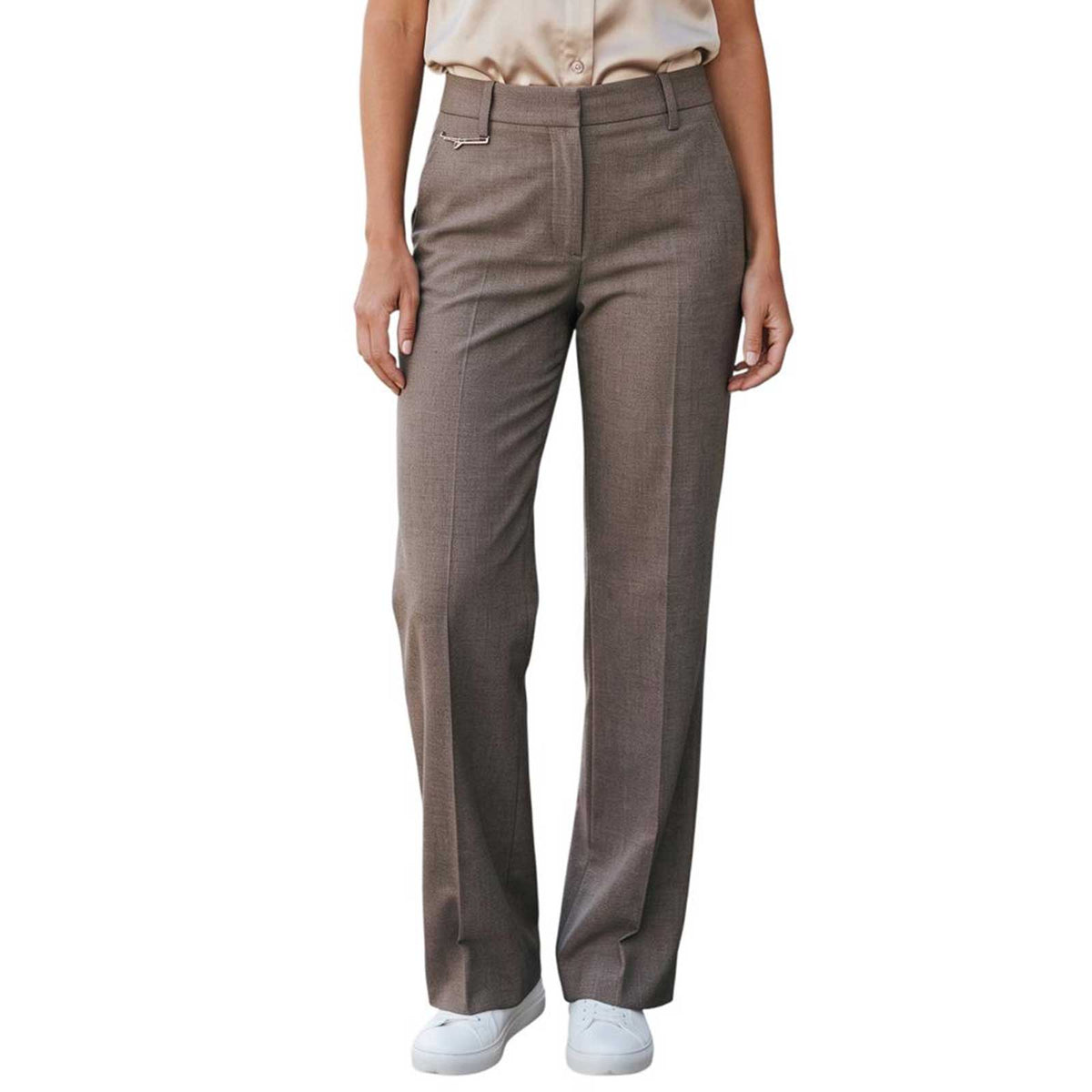 Woman wearing straight leg taupe trousers by Sand, sold at Aqualta, styled with a short-sleeve satin blouse and white sneakers.