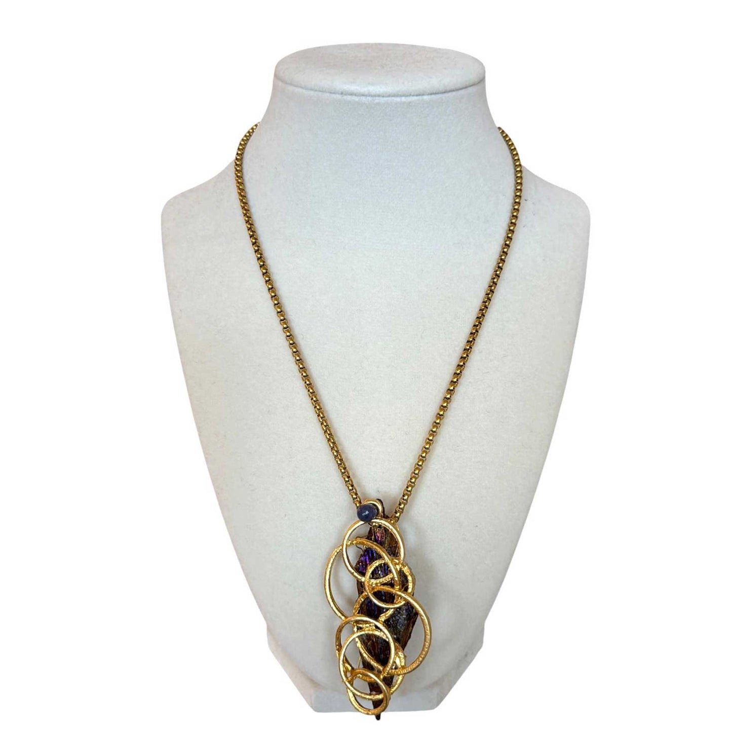 Tanzanite raw stone pendant on Necklace Pars sold at Aqualta