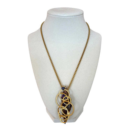 Tanzanite raw stone pendant on Necklace Pars sold at Aqualta