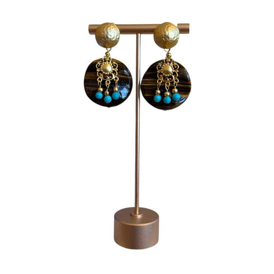 Peggy Goodman statement earrings with tiger eye discs, turquoise beads and gold-tone details, available at Aqualta.