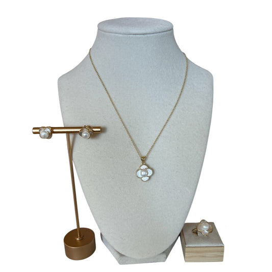 Jewelry set including a necklace, earrings, and ring on a white background sold at Aqualta