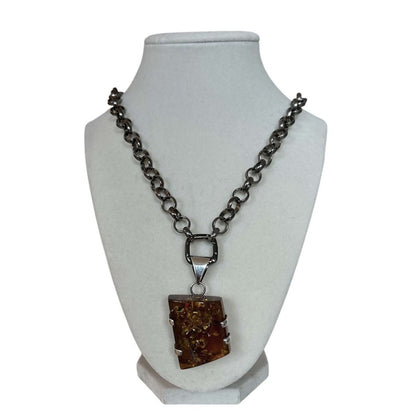 Amber pendant on a long blackened rolo chain - AQUALTA