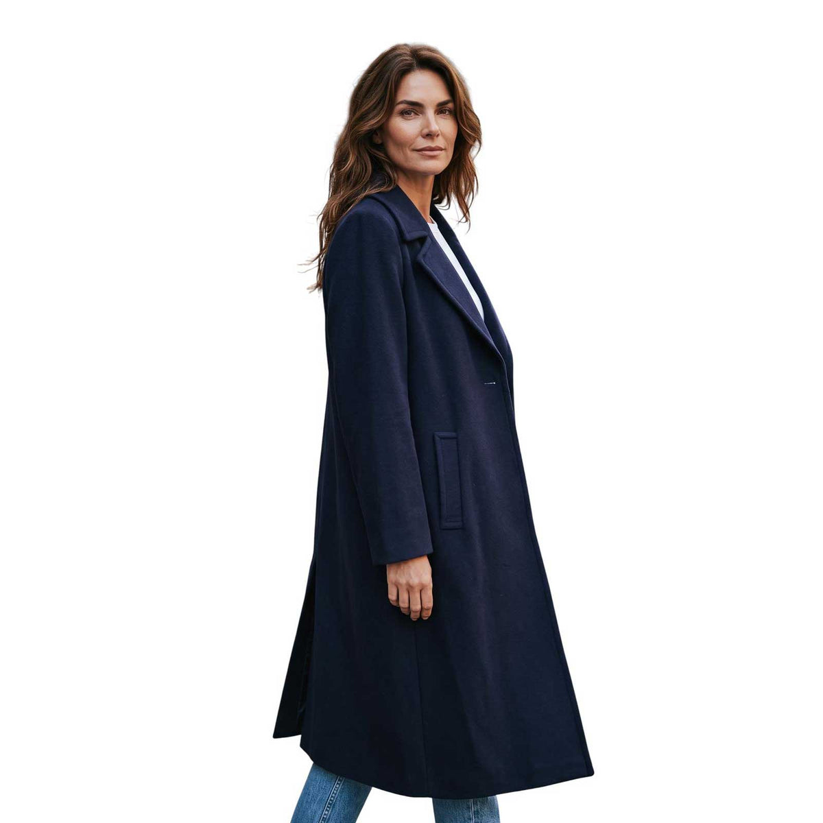 Long navy cashmere blend coat by Sand, sold at Aqualta, styled in a full-length look with casual denim and sneakers.