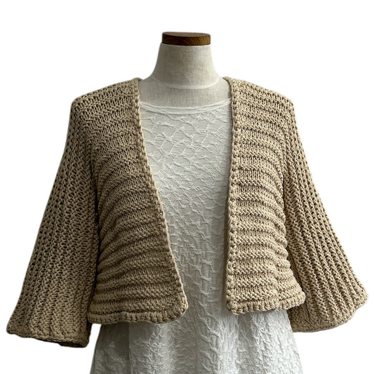 Beige knit shrug by Chiara Toffanin, handmade in Italy and sold at Aqualta