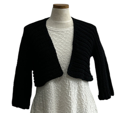Elegant black knit shrug by Chiara Toffanin, handmade in Italy and sold at Aqualta