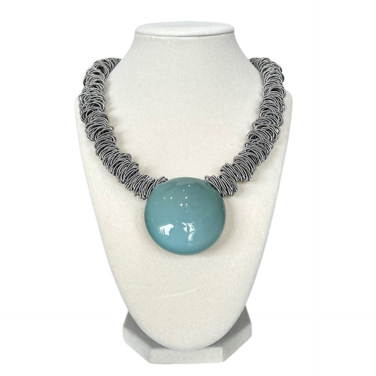 Handmade Murano glass necklace with aqua blue pendant and artistic metal coil chain, sold at Aqualta