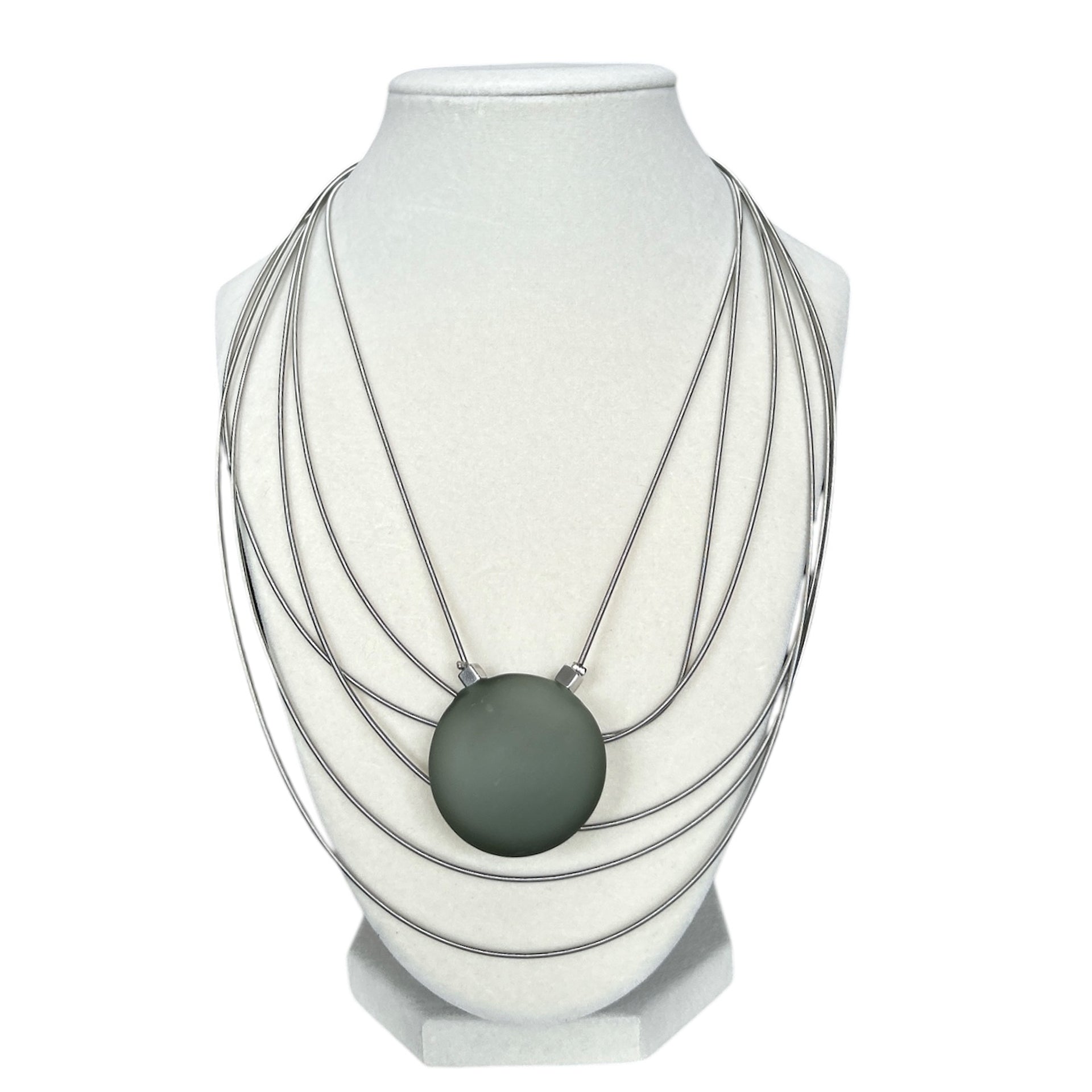 Elegant Murano glass necklace with frosted green pendant and layered silver strands, sold at Aqualta