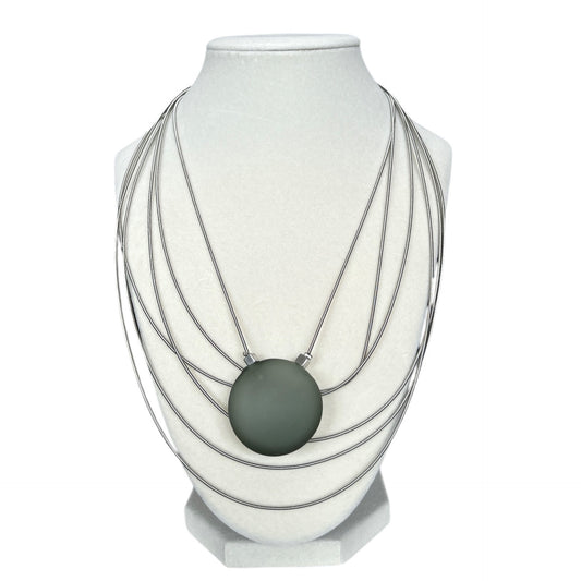 Elegant Murano glass necklace with frosted green pendant and layered silver strands, sold at Aqualta