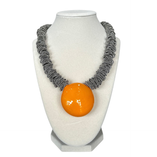 Handmade orange Murano glass pendant necklace with artistic metal coil chain, sold by Aqualta