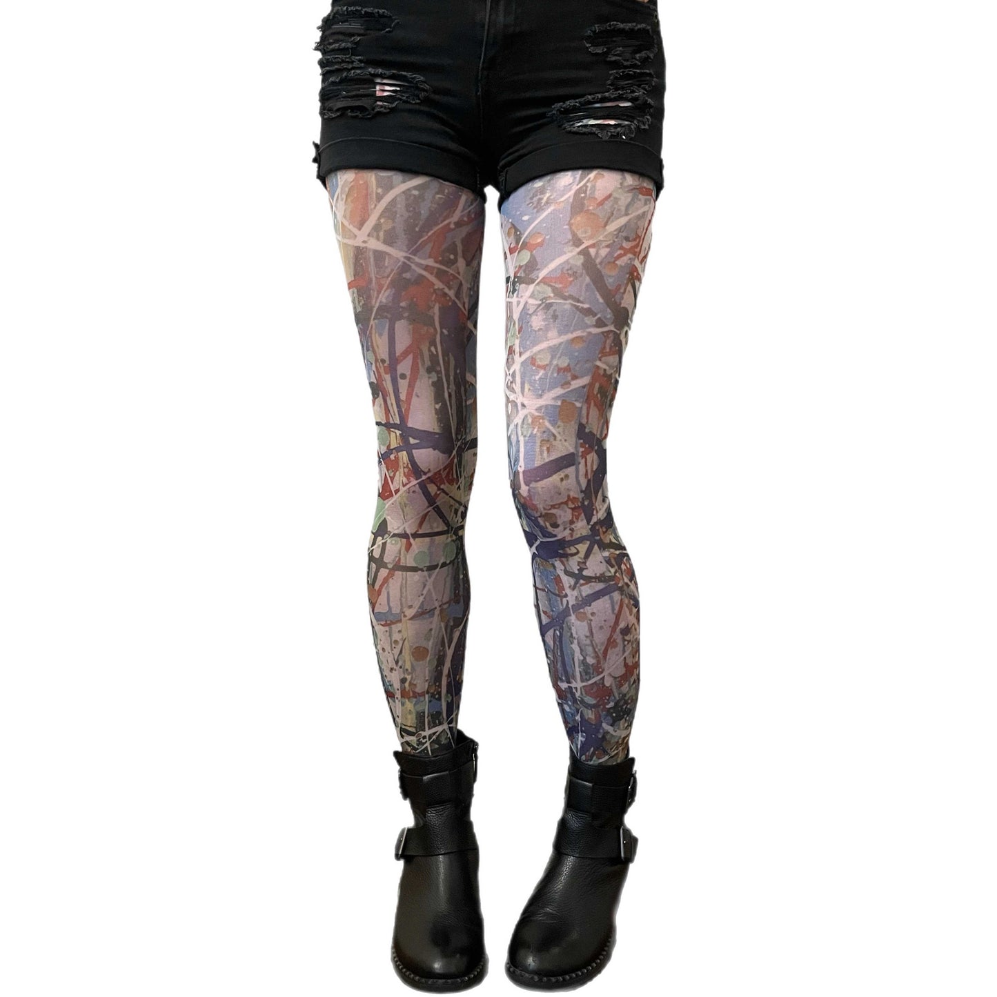 Woman wearing abstract paint-splatter patterned tights by Sinclair The Vandal, designed for Malka Chic and made in Italy 4