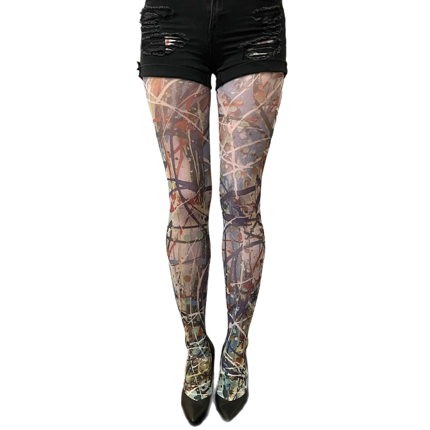 Woman wearing abstract paint-splatter patterned tights by Sinclair The Vandal, designed for Malka Chic and made in Italy 3