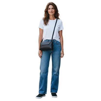 A woman modeling a Small Crossbody Black Biagini sold at Aqualta
