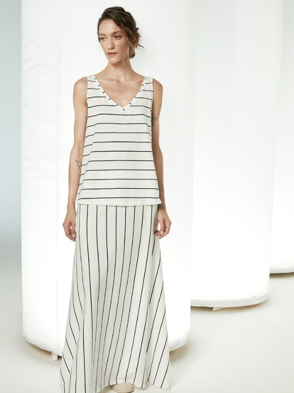 Crafted with precision and elegance in Italy, this skirt is a timeless piece